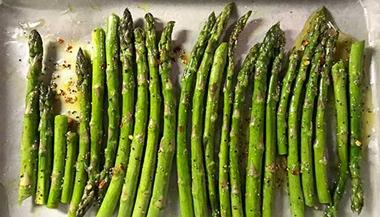 Rosemary asparagus on a baking sheet